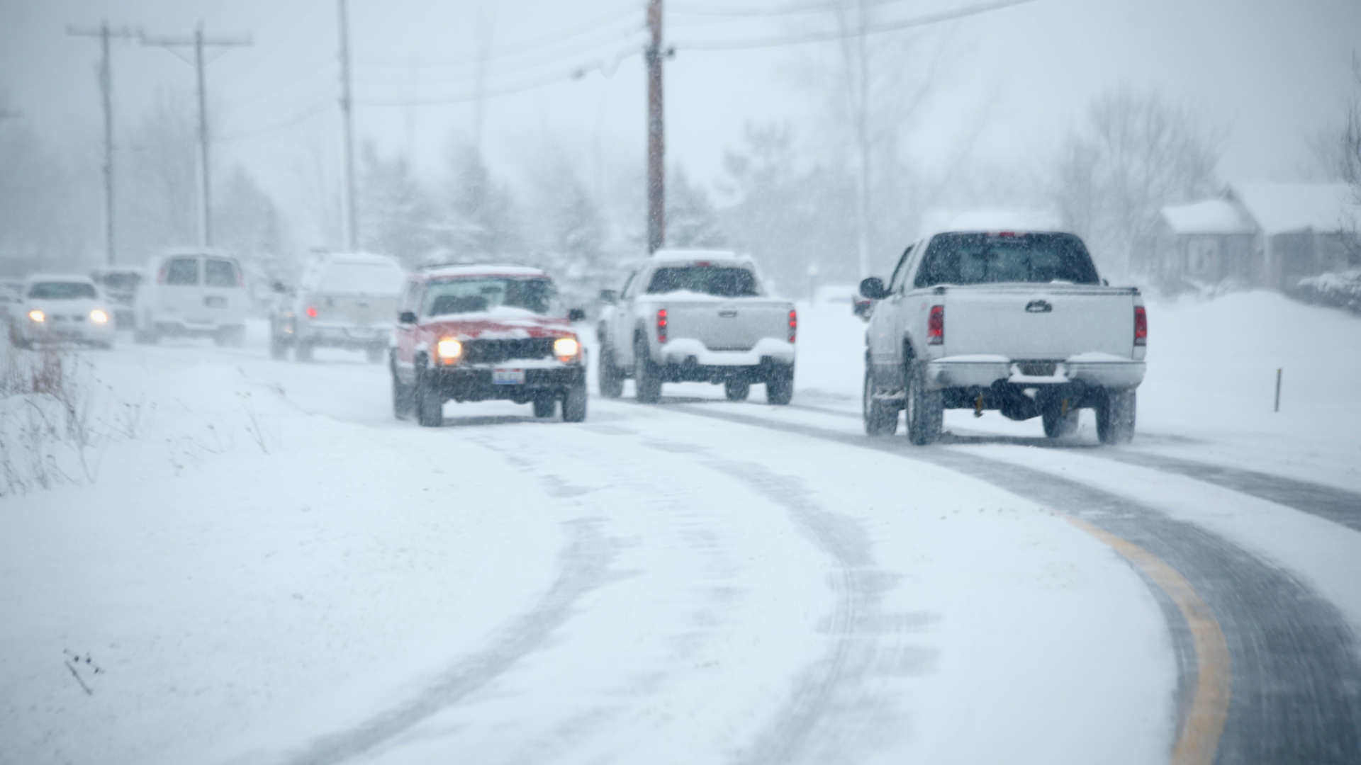 Vehicles driving in snowy conditions