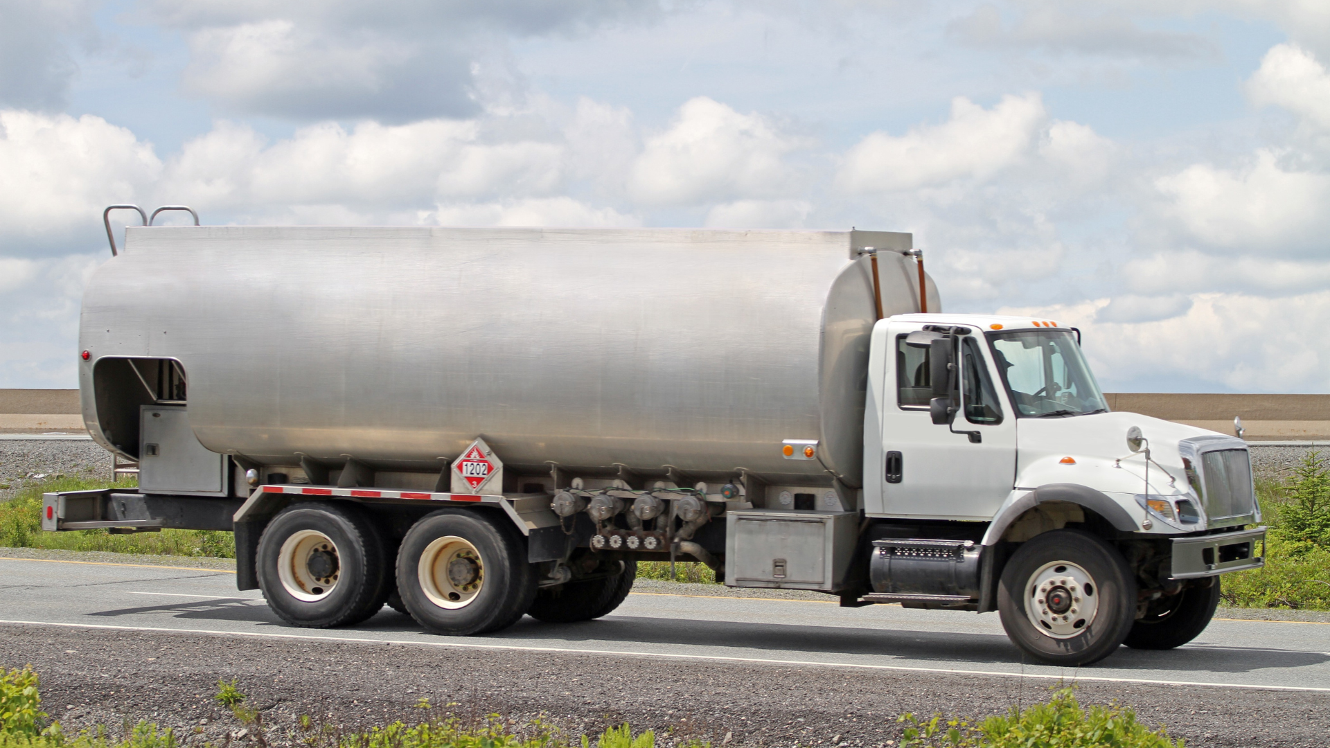 An oil tanker truck on a rural road