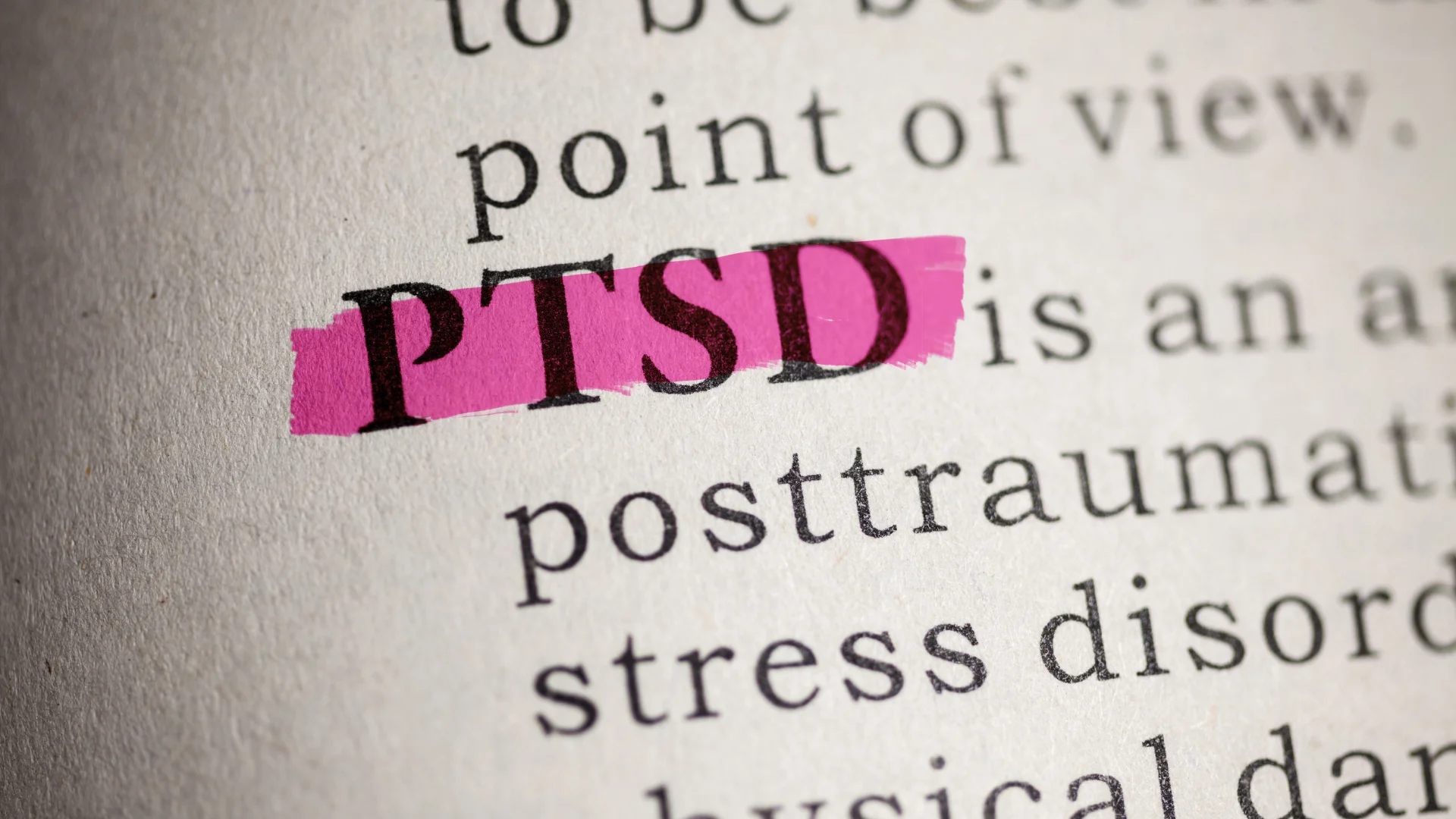 A book page highlighting the term PTSD