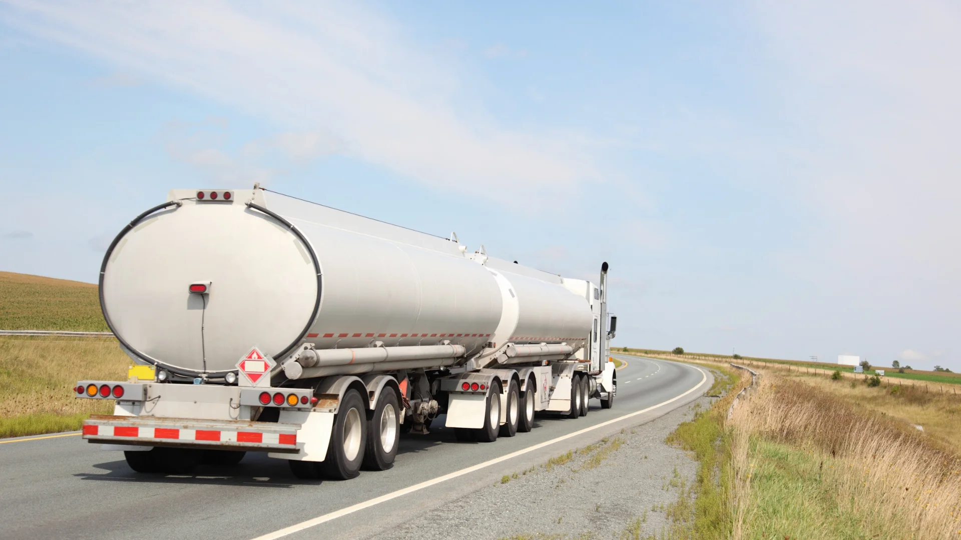 A tanker truck on a rural highway in Wyoming