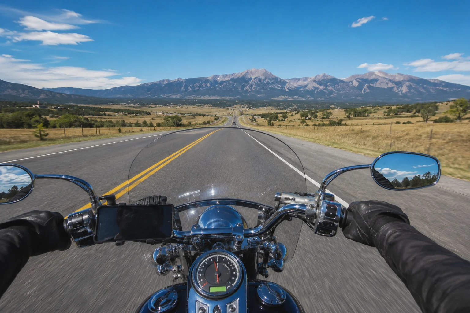 Fort Collins motorcyclist riding a northern Colorado highway during peak summer riding season