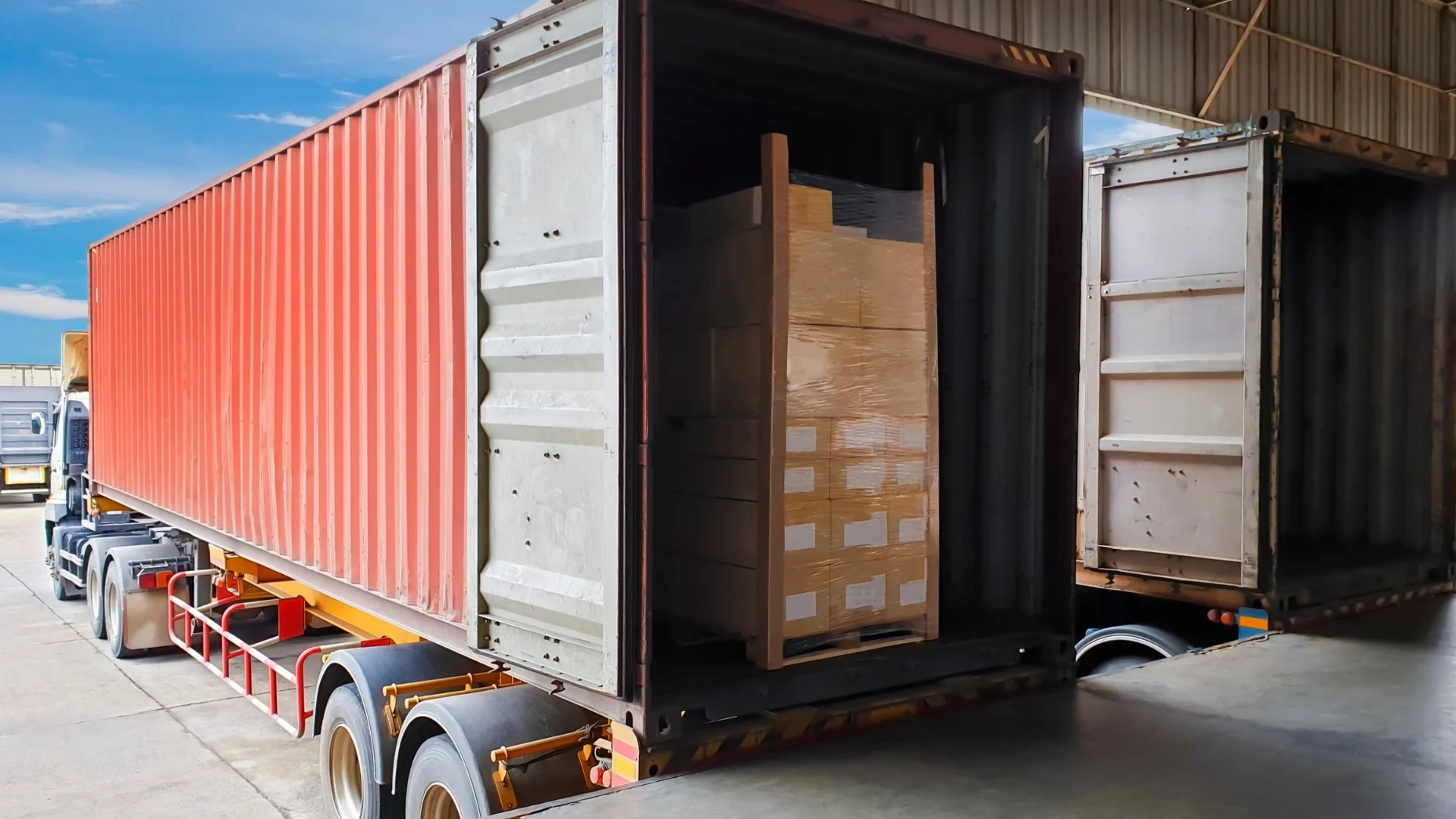 A semi truck trailer at a loading dock