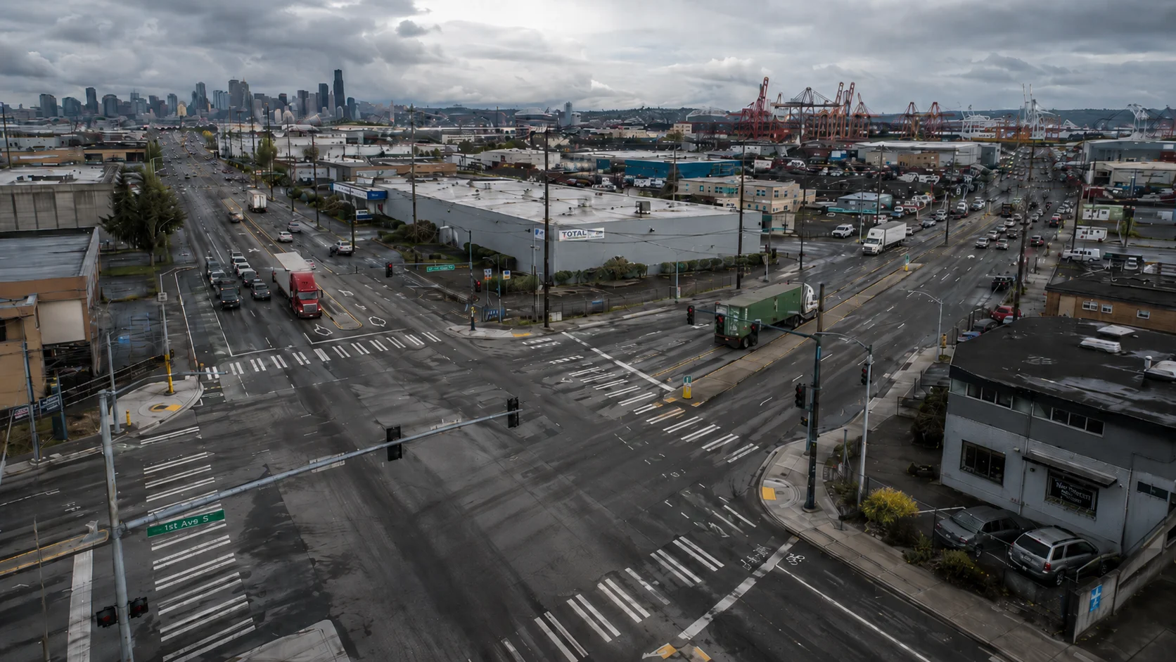 Aerial view of a Seattle freight corridor and intersection with heavy truck traffic