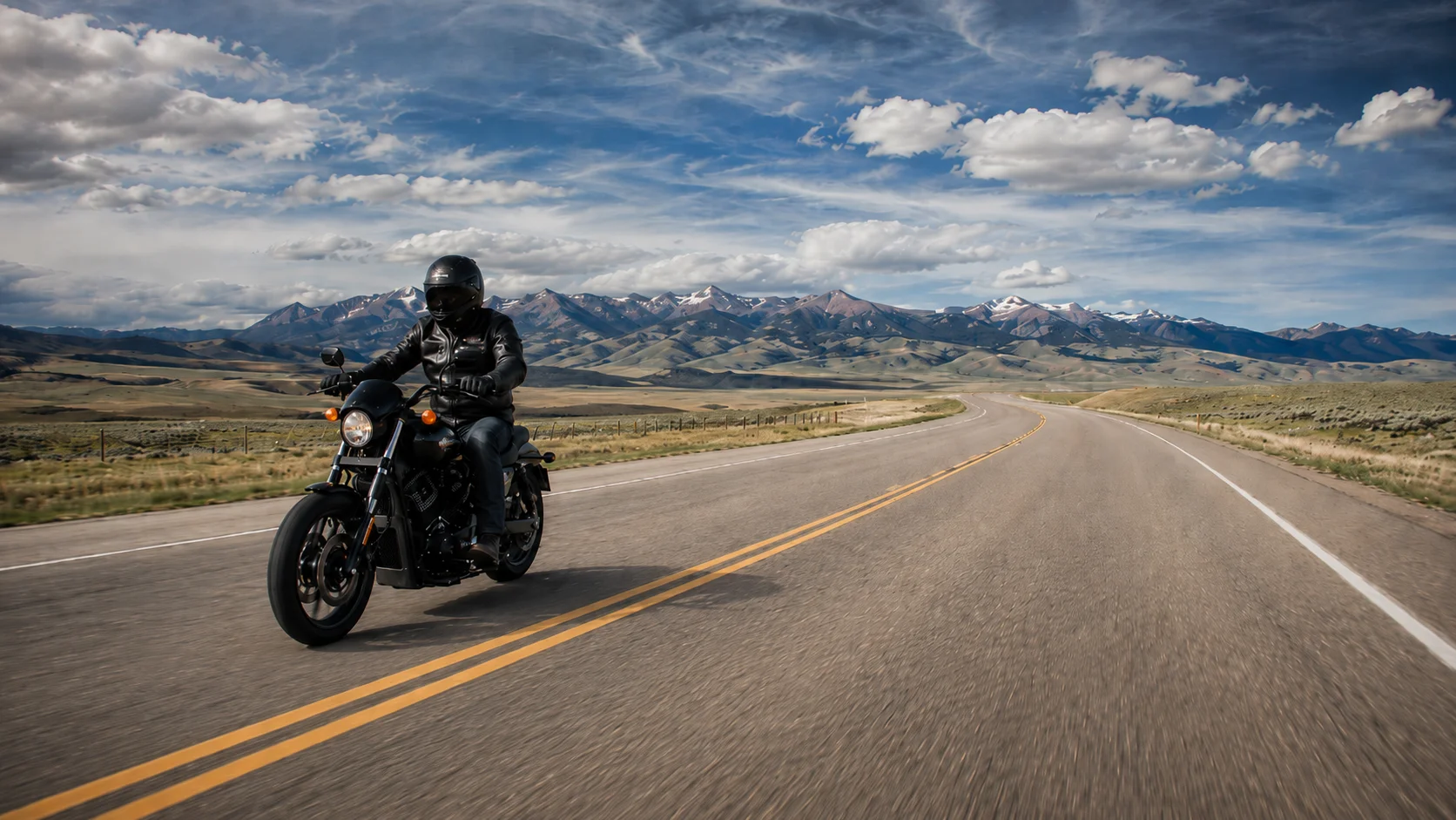 Cheyenne motorcycle rider in protective gear on a Wyoming highway