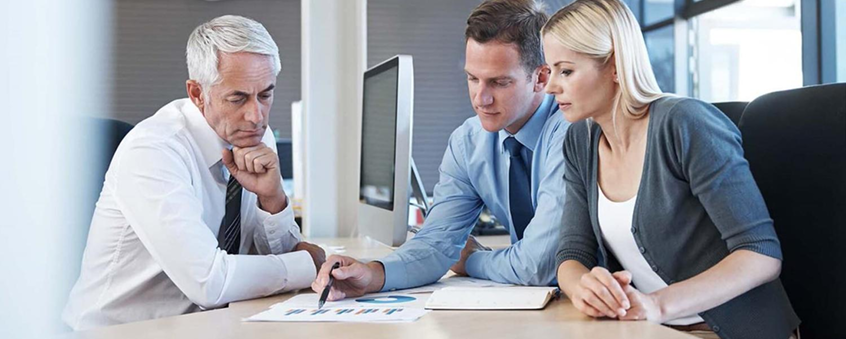 Tax professionals reviewing financial documents during client consultation at Clear View Financial Services.