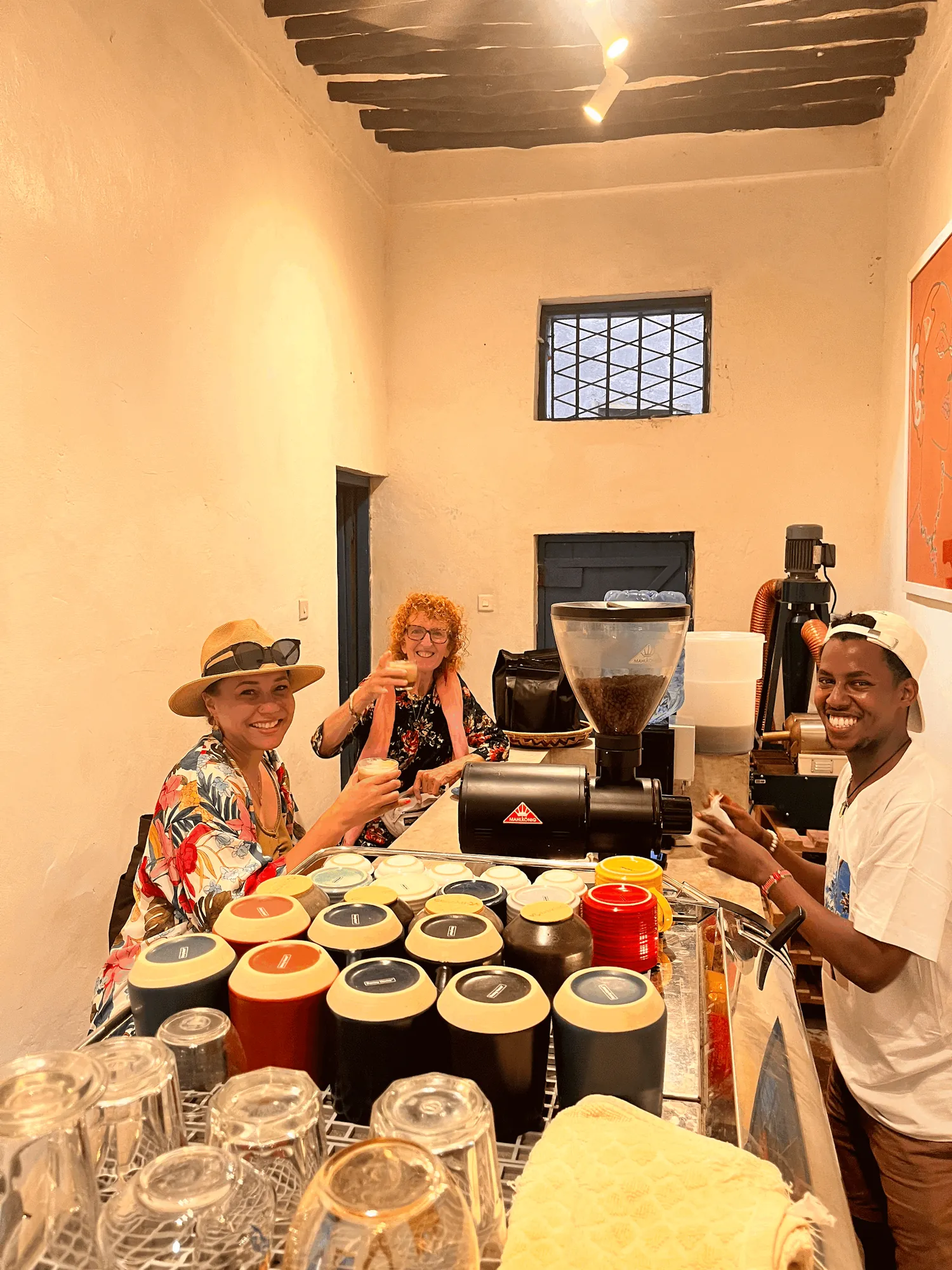Trainee serving coffee to guests on Lamu Island