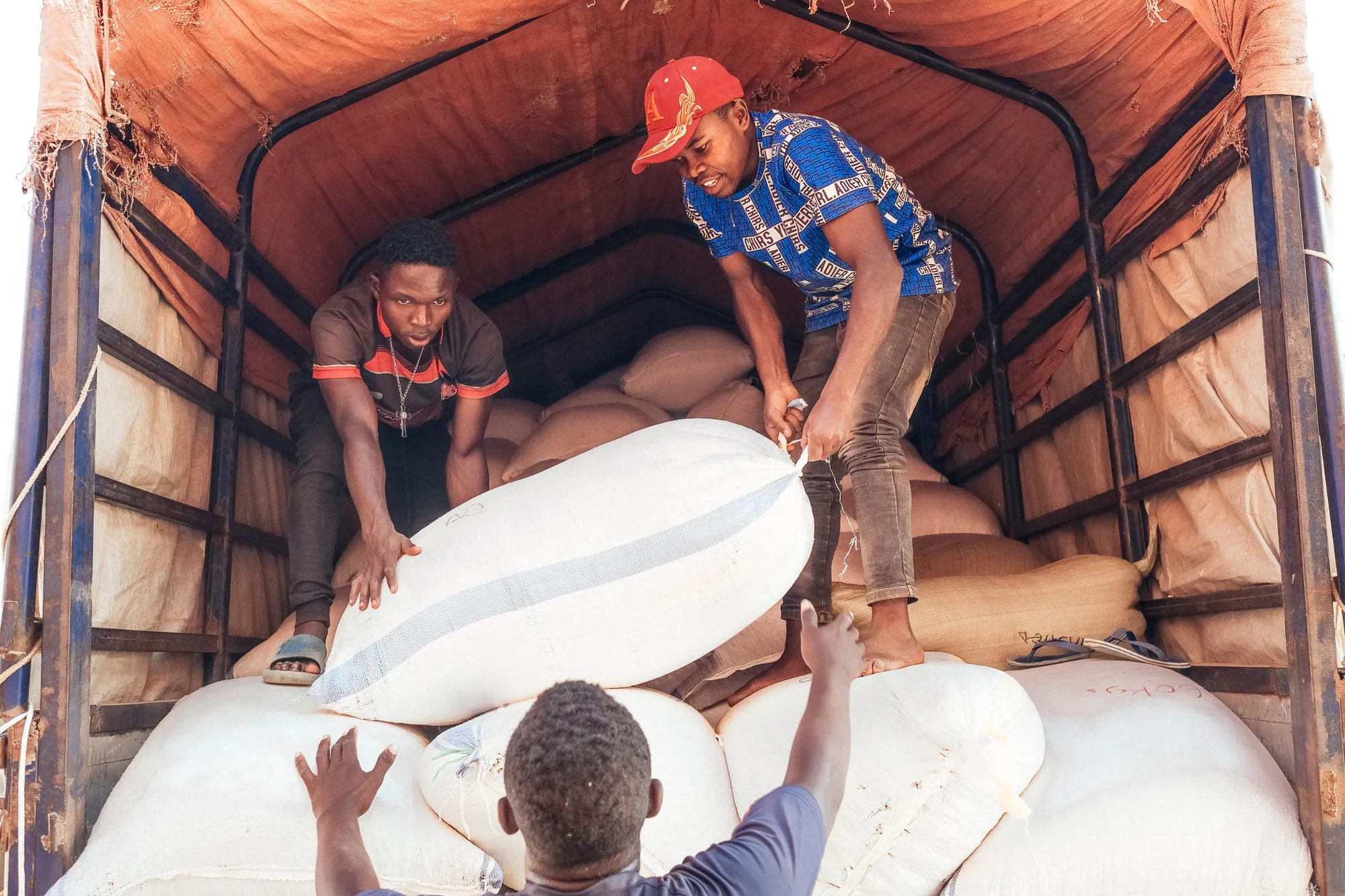 Loading coffee onto a truck at Zukuka Bora