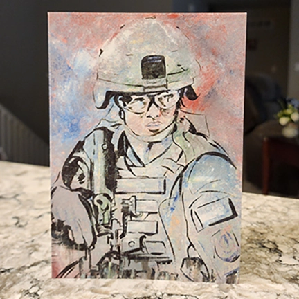 Inscription: She walks with honor in boots well worn,
Through battles fought and duty sworn.
With steady hands and head held high,
She guards the flag that waves in sky. Thank you for your courage, and your heart.