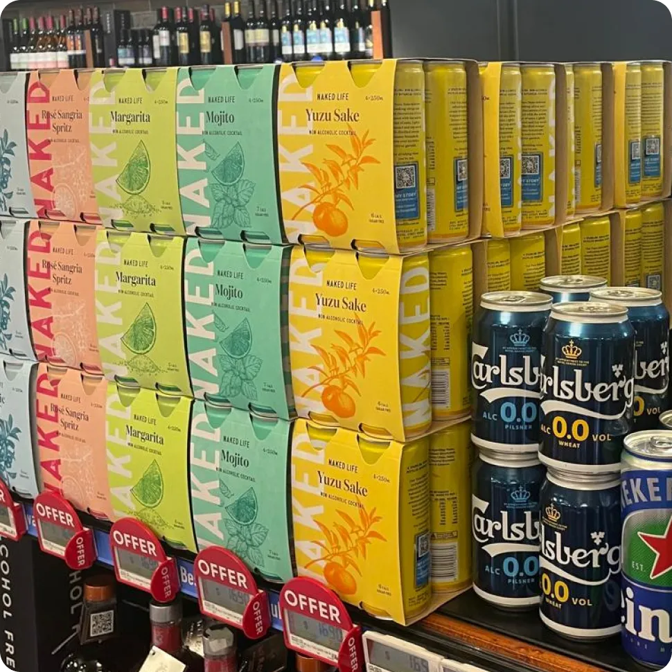 Shopper scanning the QR code on a Naked Life can with a smartphone