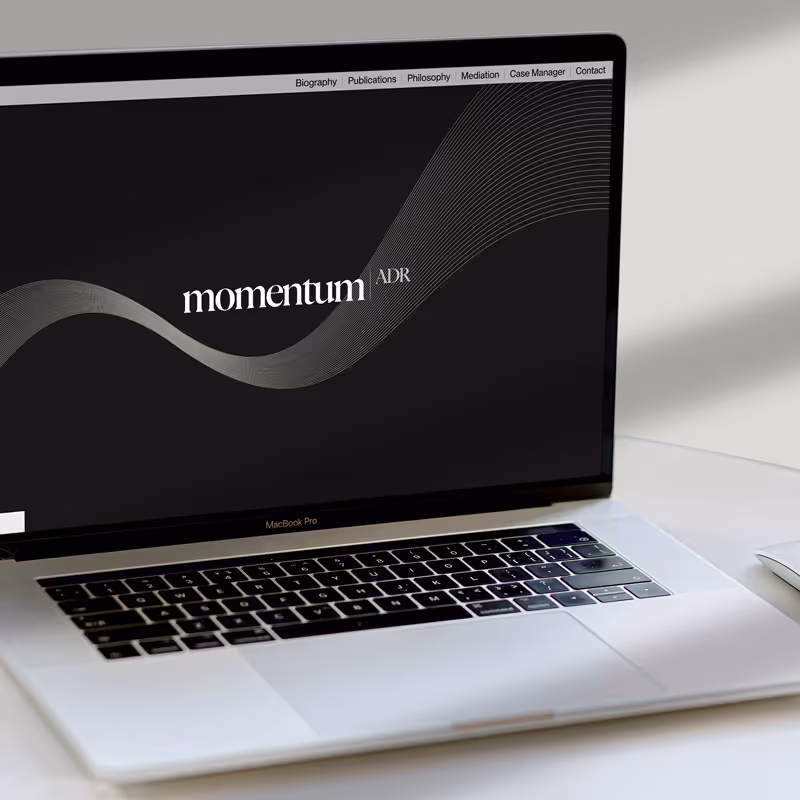 Preview of the Mediator ADR web design project by Ruta Dambrauskaite, shown on a Macbook on placed a desk