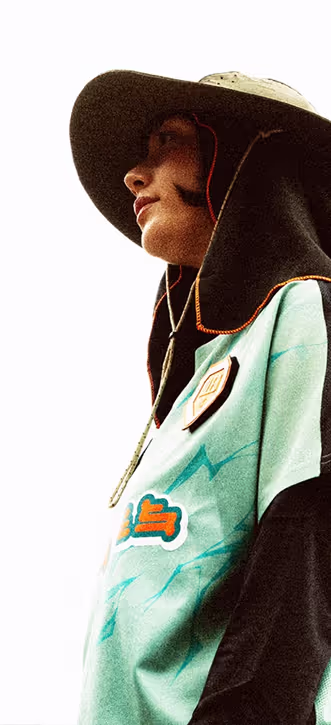 A female wearing BLED FC football kit
