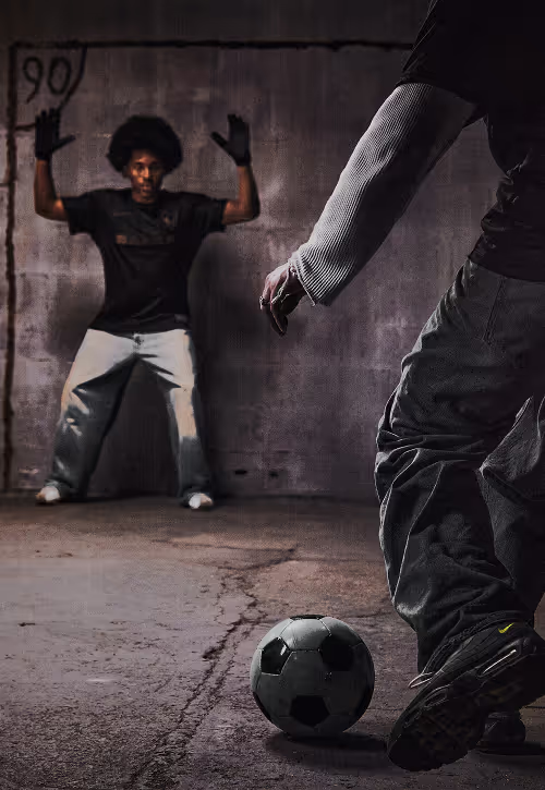 A group of young people wearing BAARA playing football