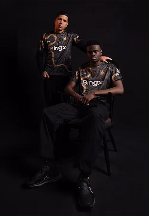 Two young athletes wearing Chelsea uniform