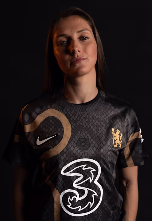 Female athlete wearing Chelsea football uniform
