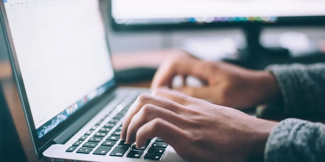 Professional using the internet to participate in online groups and communities in order to strengthen their networking
