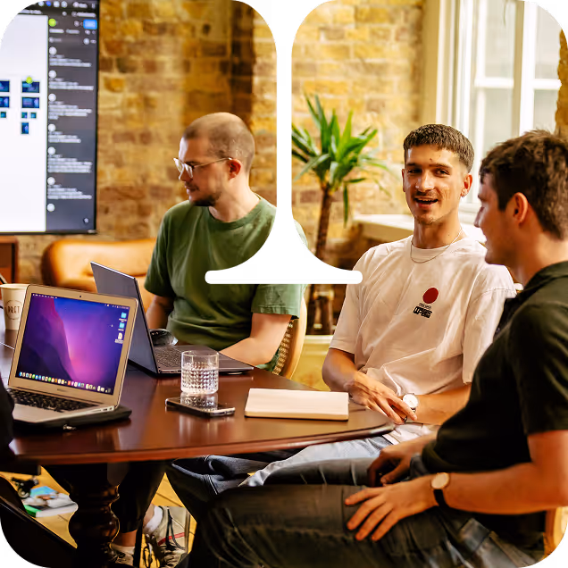 Team 4 members collaborating around a table