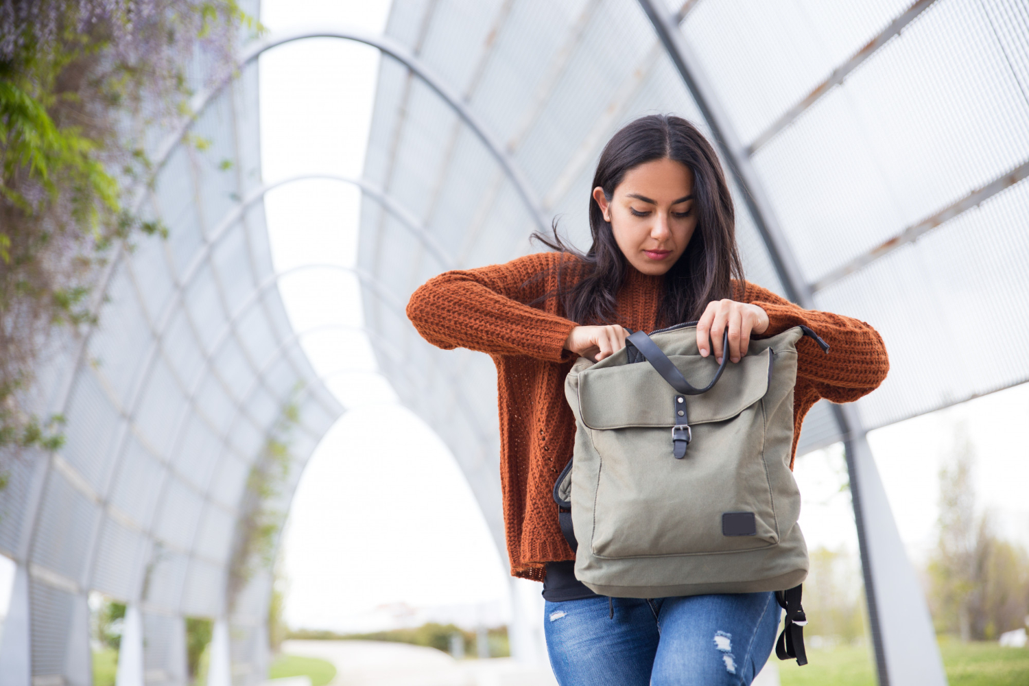 A student checking her backpack on the way to the SAT test center, making sure she has everything prepared for exam day.