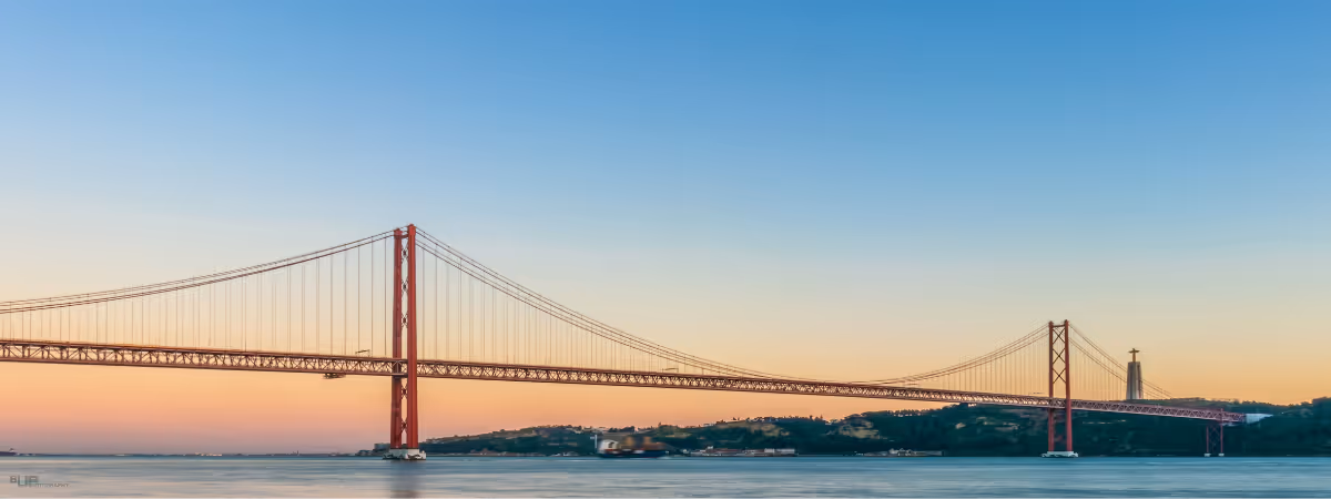 Photo of the iconic Lisbon red bridge at Sunset