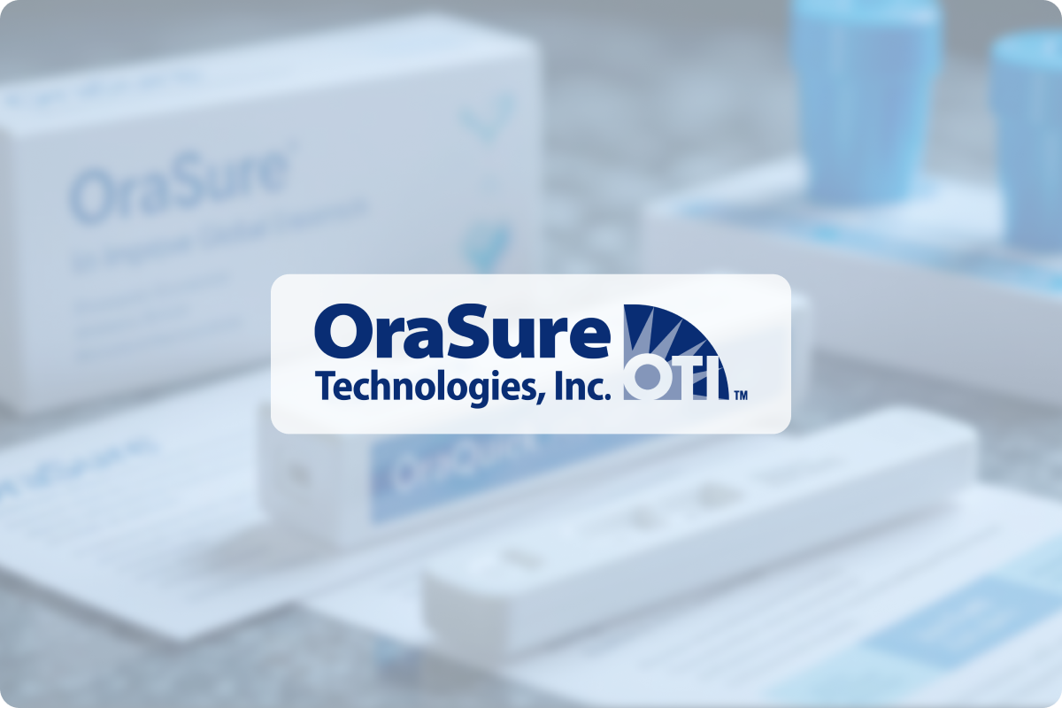 Logo of OraSure Technologies, Inc. prominently displayed over a blurred background featuring diagnostic medical testing kits and blue specimen collection devices. The logo includes bold blue text and a stylized semicircle design with radiating lines and th