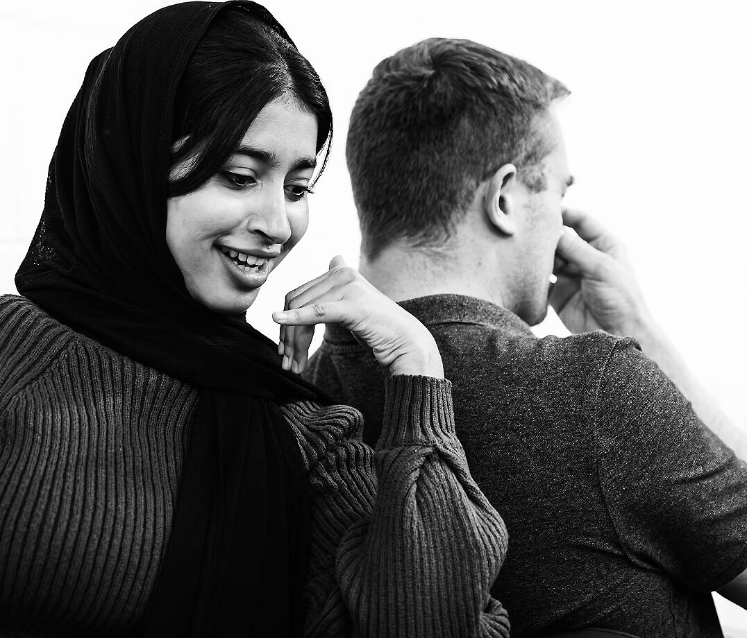 Two people role playing a telephone conversation