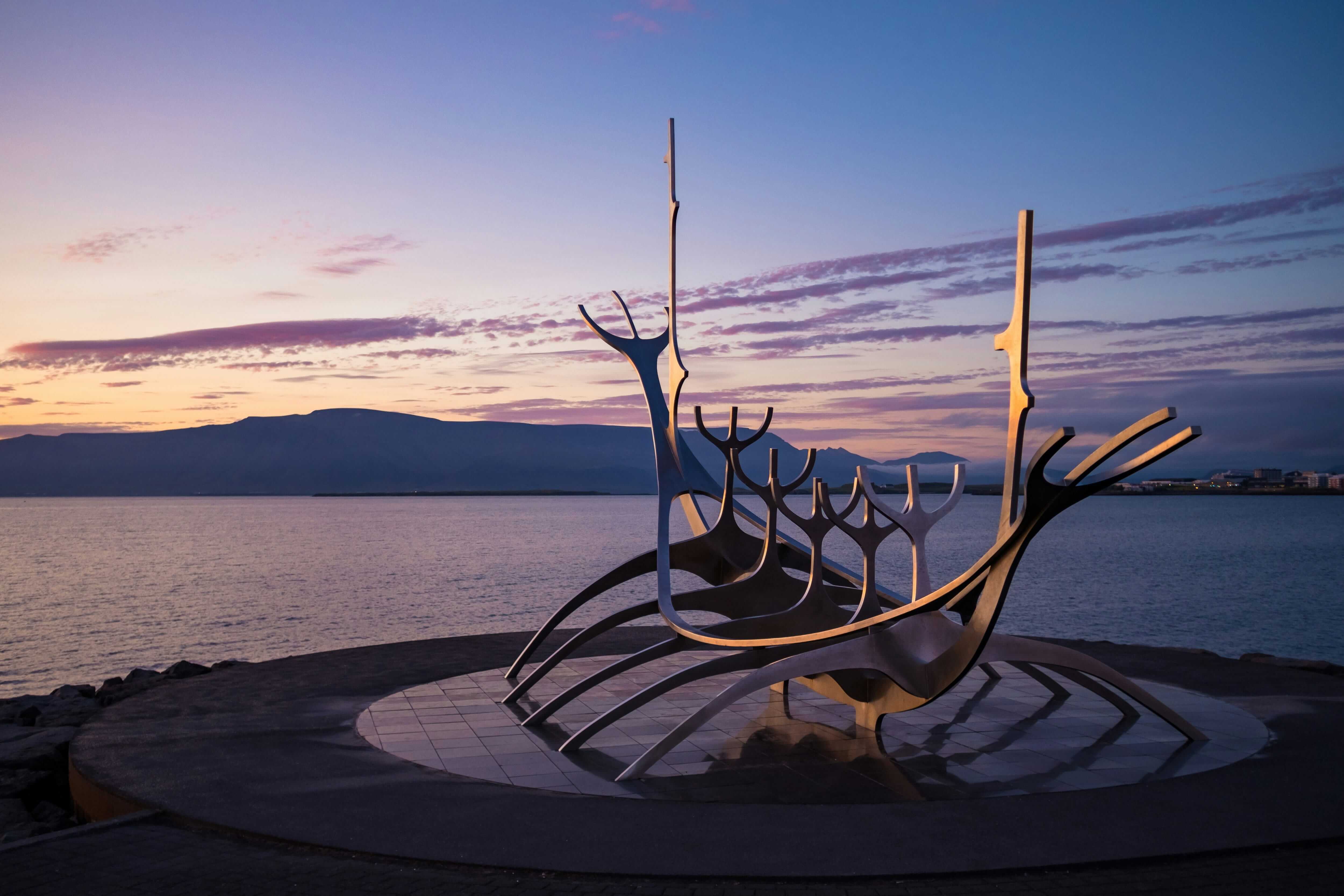 Sun Voyager sculpture on Reykjavík waterfront at sunset