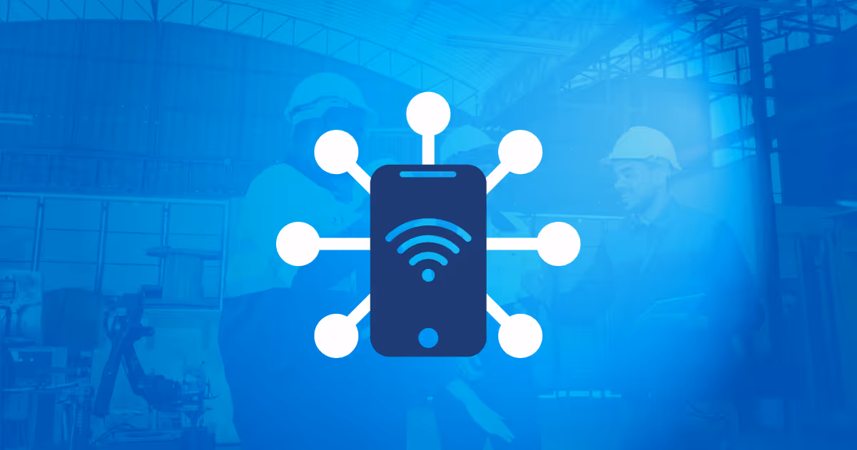 Icon of a smartphone with Wi-Fi signal and connected nodes, over a blurred background of workers in a factory.