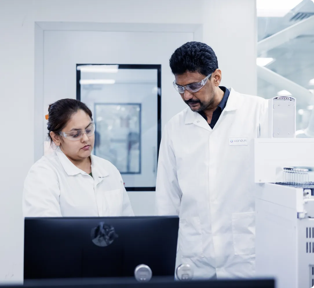 Scientists collaborating on process development in a state-of-the-art lab