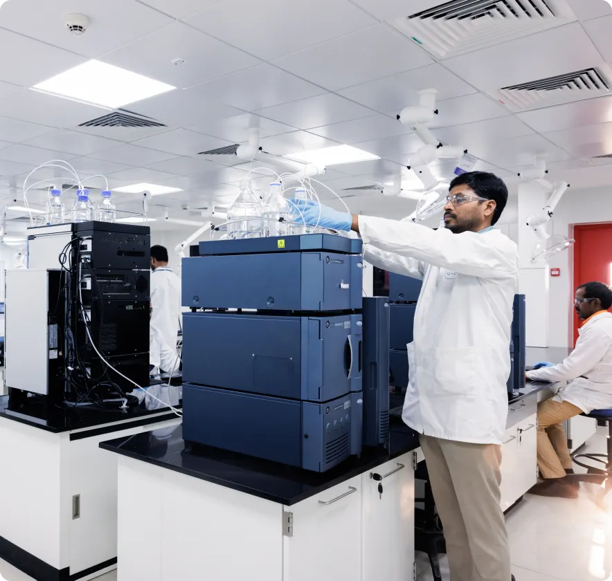 Lab technician monitoring an experiment during process development to ensure efficiency and precision