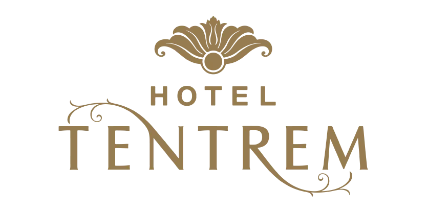 Logo Hotel Tentrem dengan ornamen dekoratif di atas dan garis melengkung menghubungkan huruf.