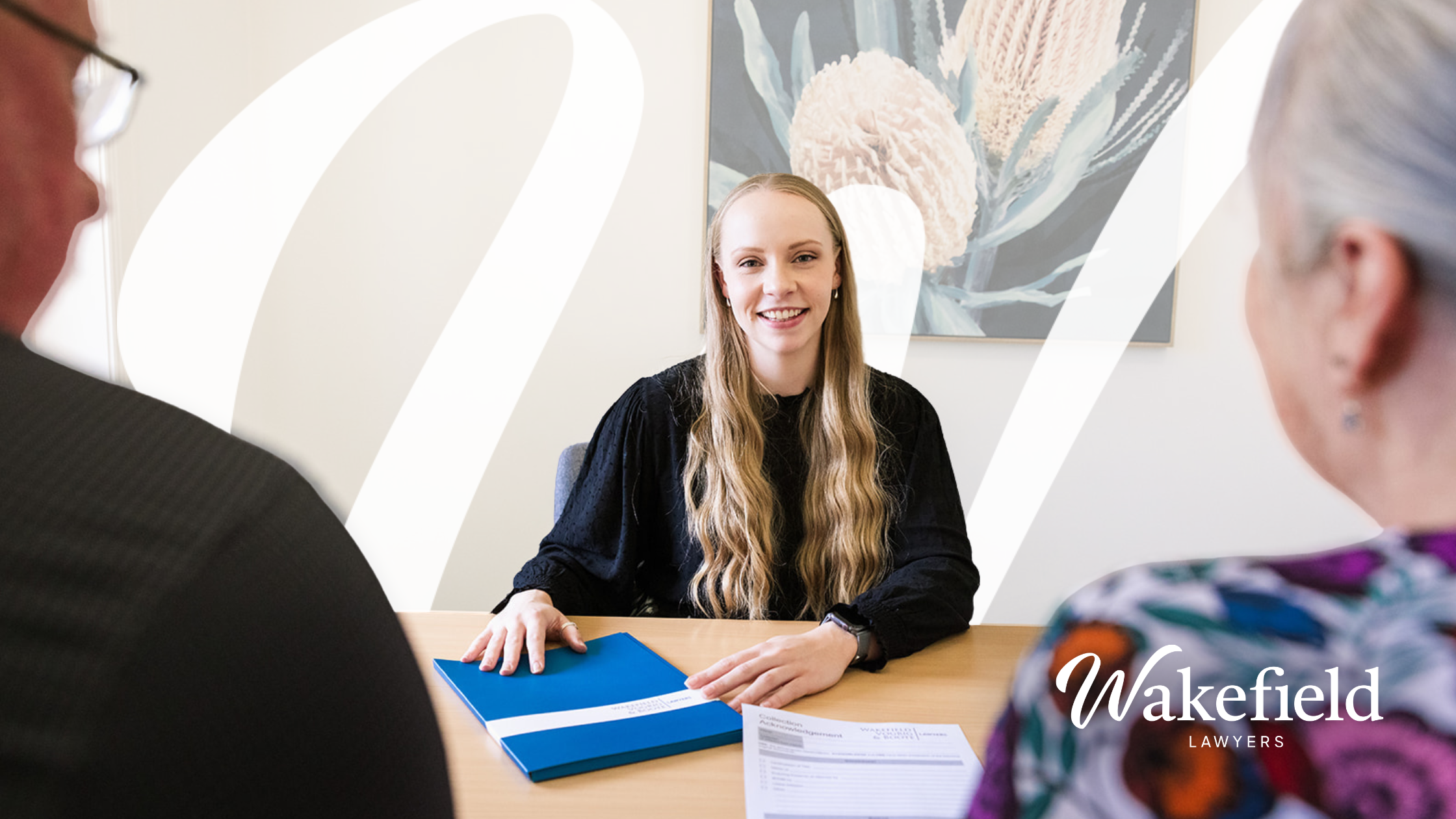 Pictured is family lawyer Lauren Van Der Veen discussing matters with clients 
