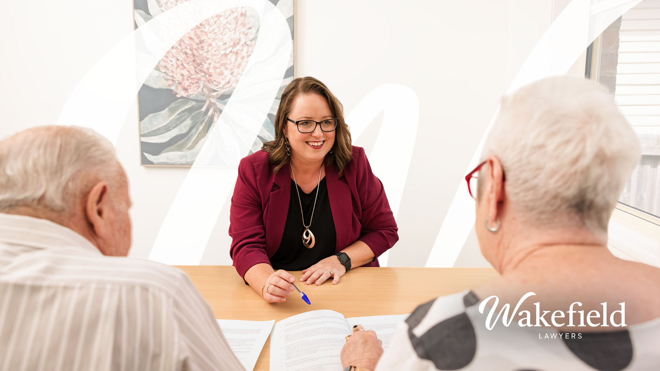 Pictured is Kylie Boote Lawyer explaining documents to clients