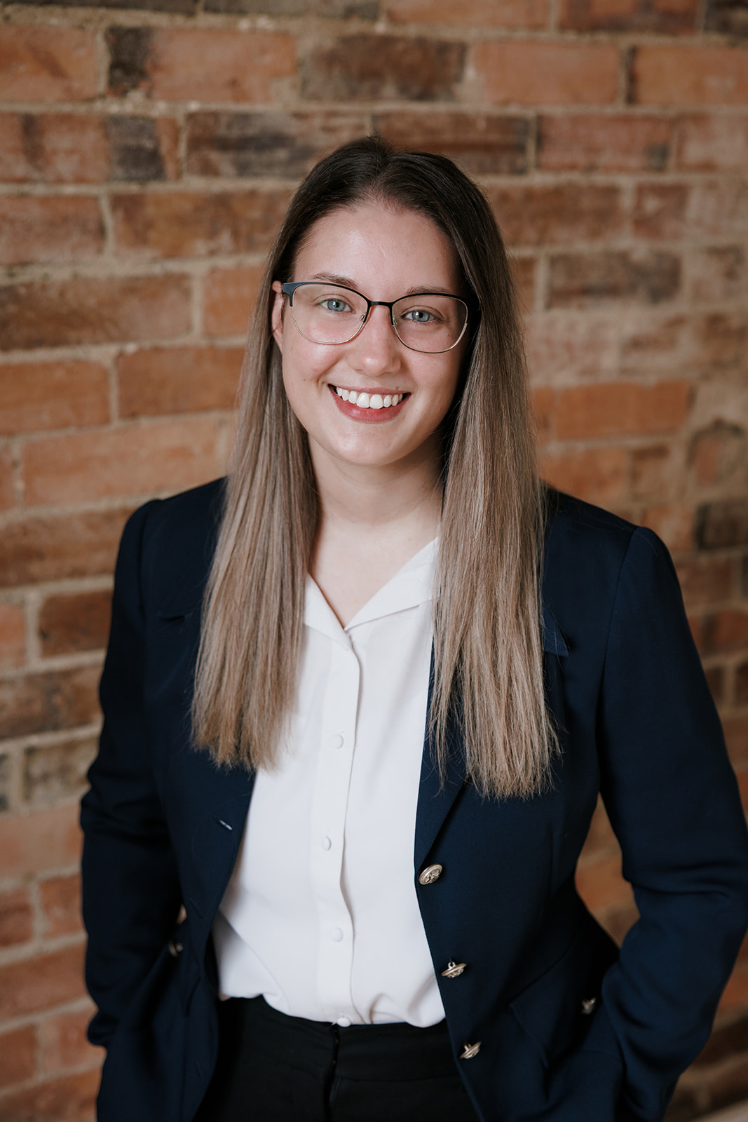Amy Kettunen of Wakefield Lawyers standing in front of a brink wall