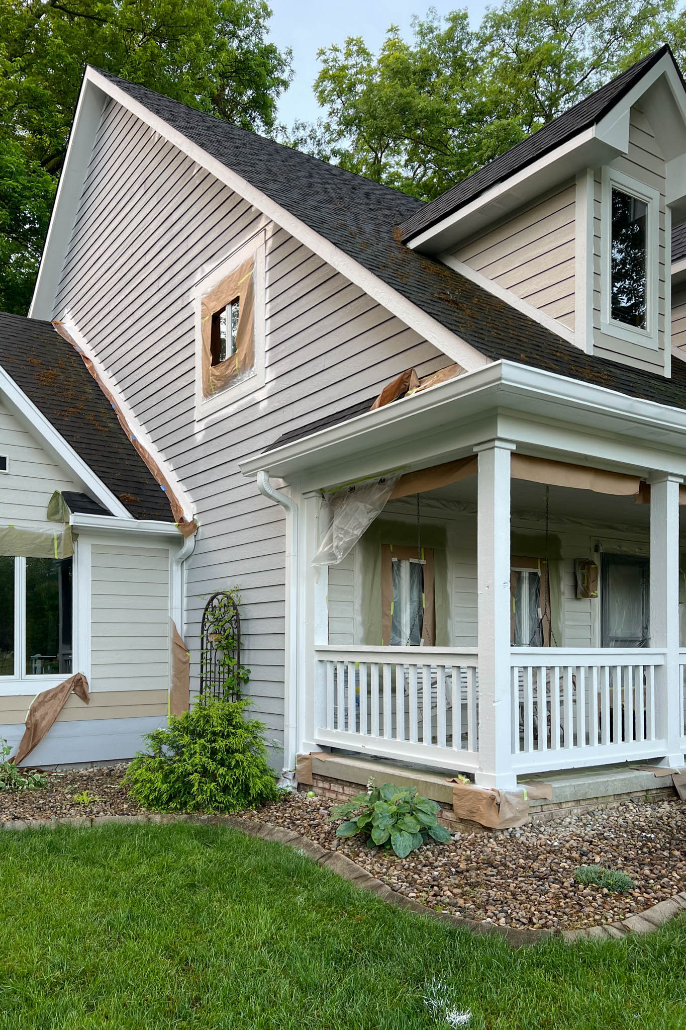 View of front of house with newly painted siding the color beige.