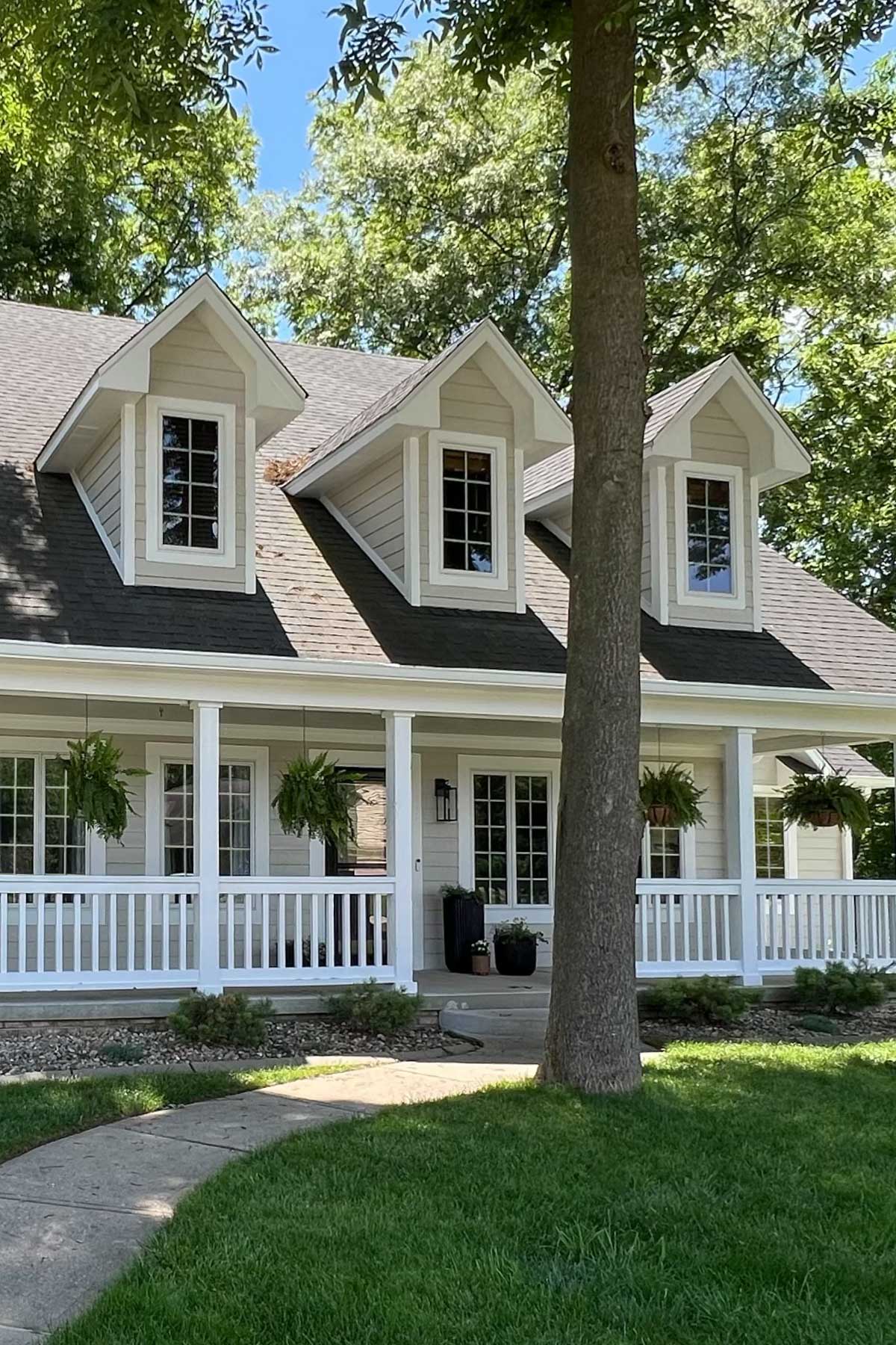 We finally finished our exterior makeover, and it looks amazing! Our house went from a light blue with faded paint to a modern and stylish greige.