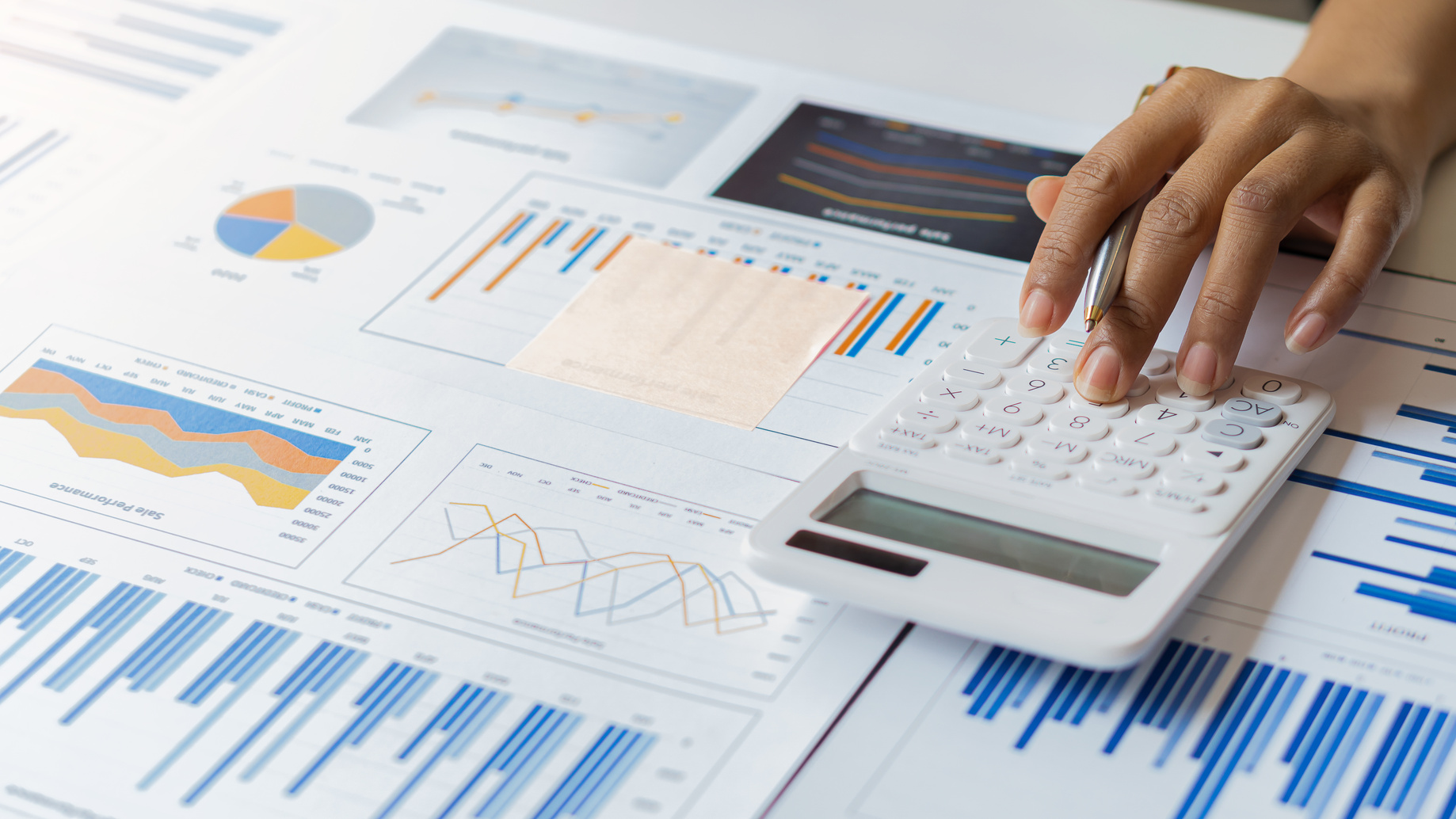 Finance professional analyzing charts and reports