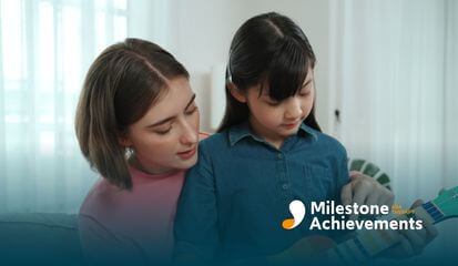 A female ABA therapist guiding autistic young girl on how to play a colorful children's guitar during ABA therapy.