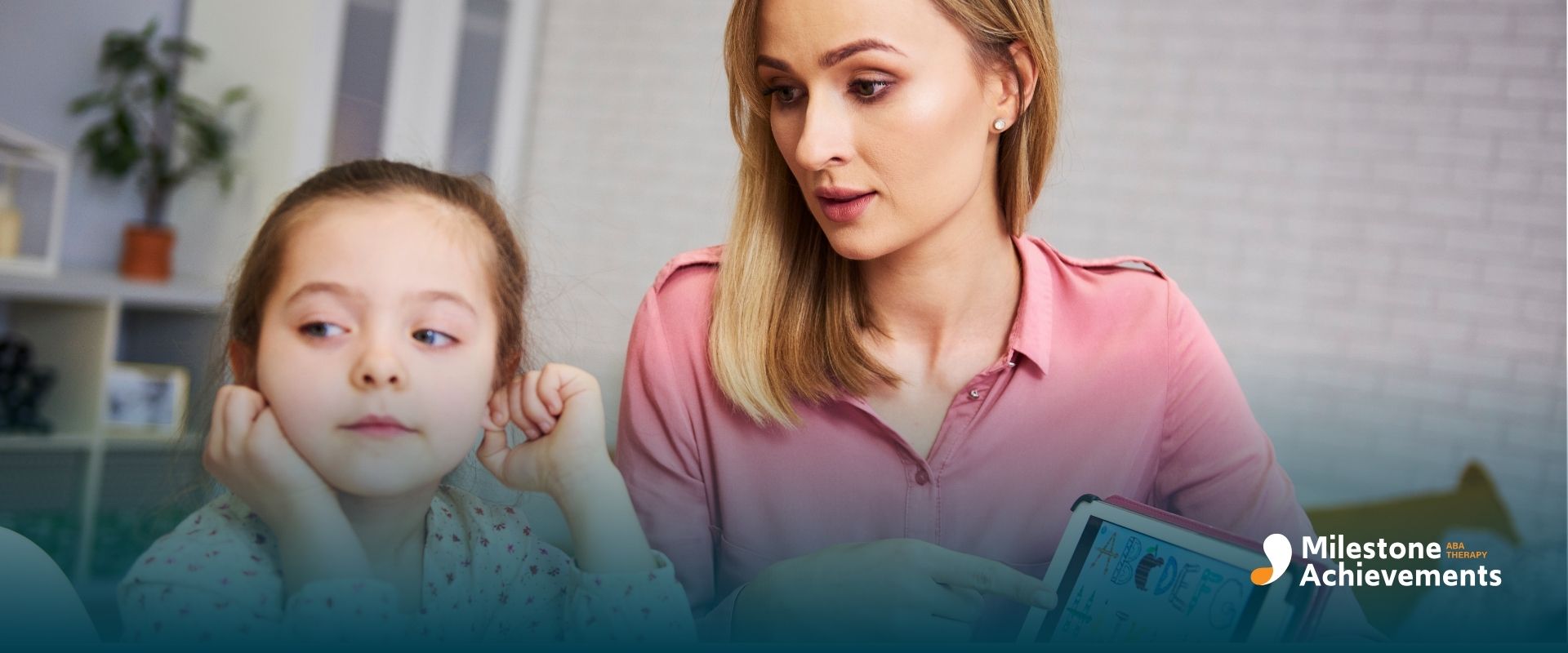 ABA therapist pointing to letters on a tablet while an autistic girl practices recognizing sounds and language patterns.