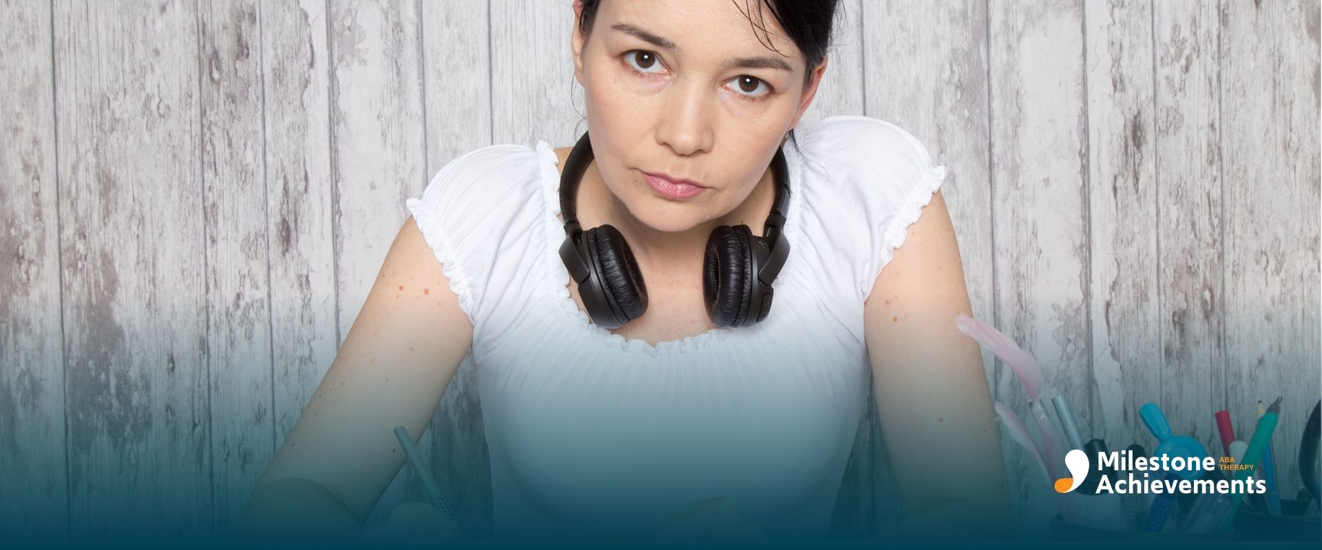 ABA therapist practicing focused writing in a notebook, representing self-guided behavior strategies and personal skill.