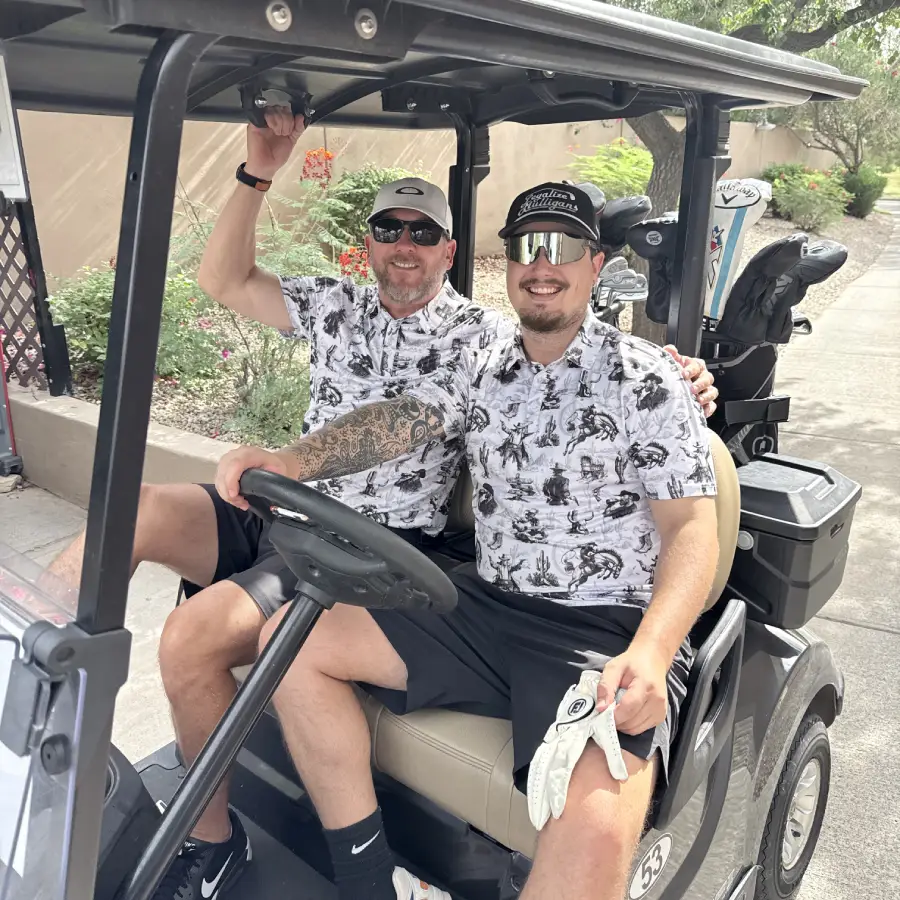 Two Crossfit Incite men in a golf cart