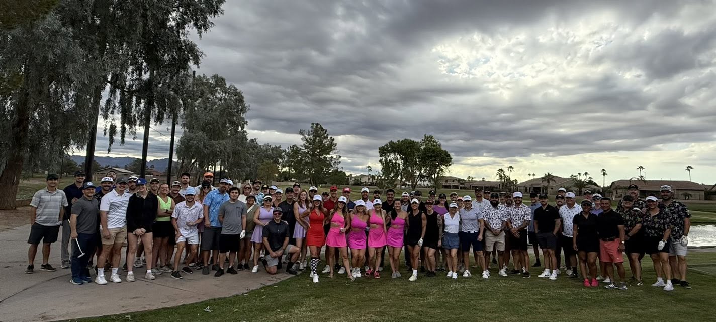 Large group photo of CrossFit Incite golfers at the 2025 CrossFit Incite Golf Tournament, many wearing pink