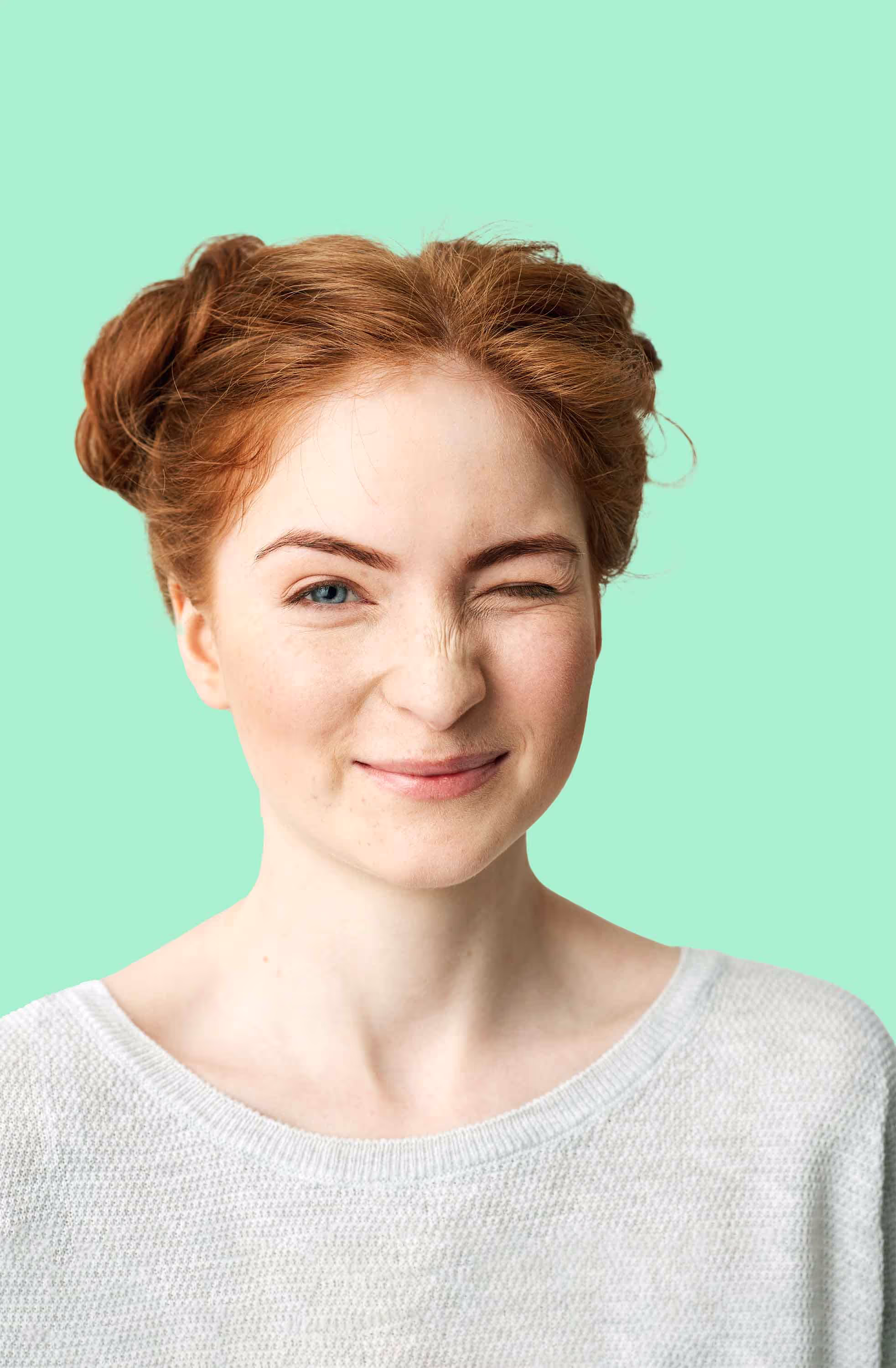 A portrait of a playful woman winking, an active EcoRoots volunteer.
