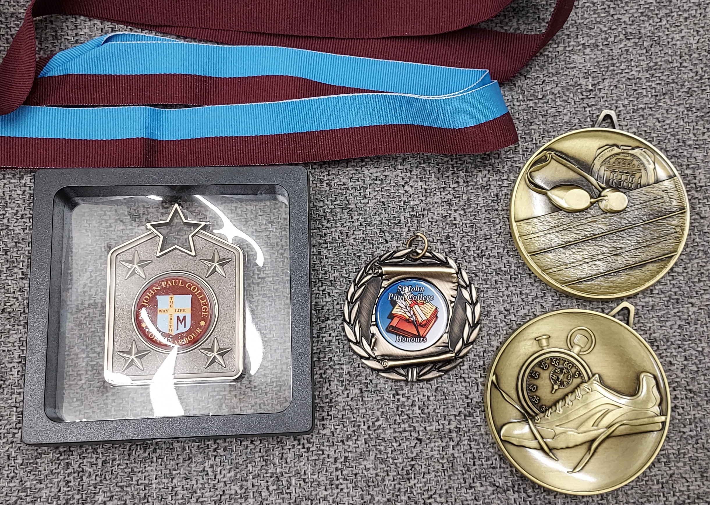 School sport or academic medals from Greg's Trophies Coffs Harbour