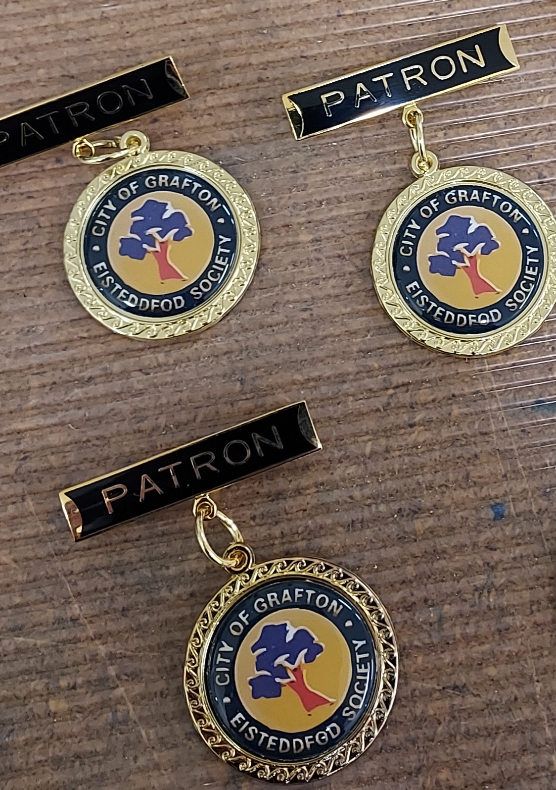 customised badges for sporting and community clubs from Gregs Trophies Coffs Harbour