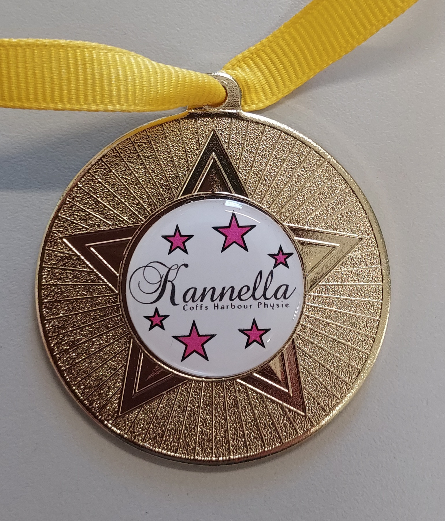 Customised medals from Gregs Trophies Coffs Harbour