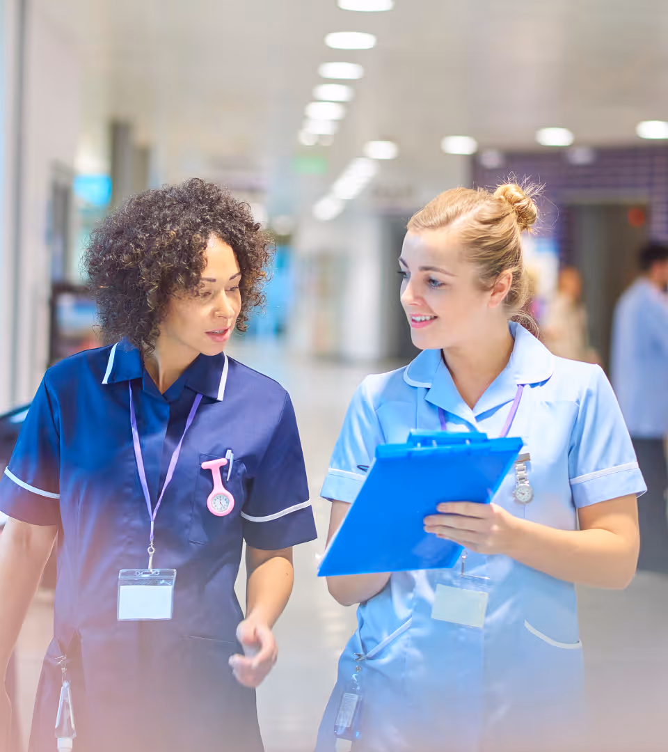 A care worker and manager in a genuine workplace check-in conversation
