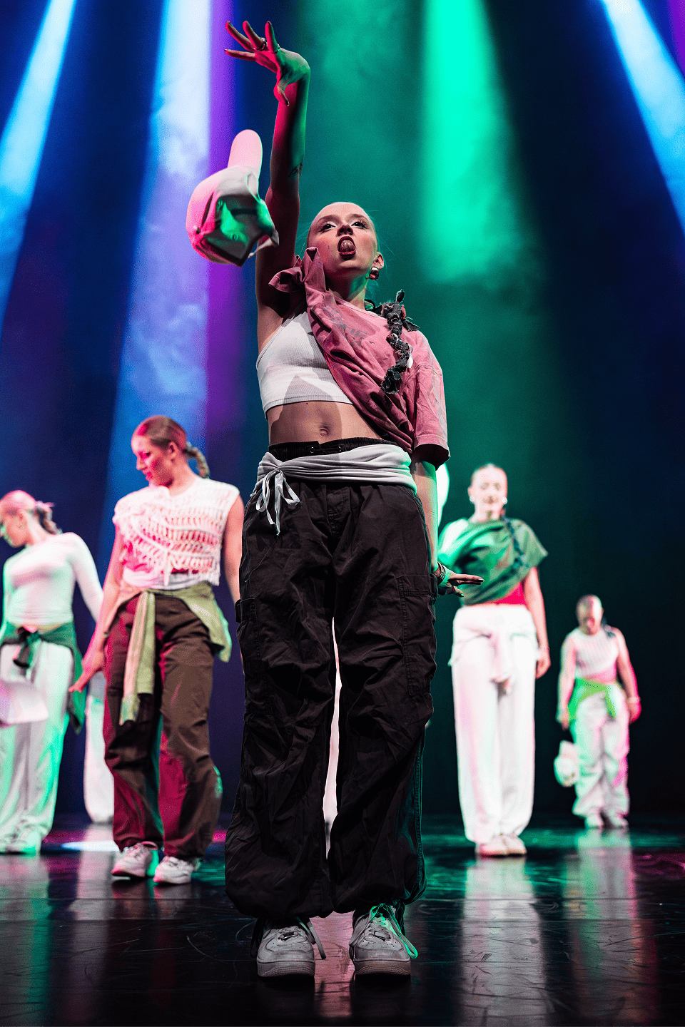 Dancer with hands to the side.