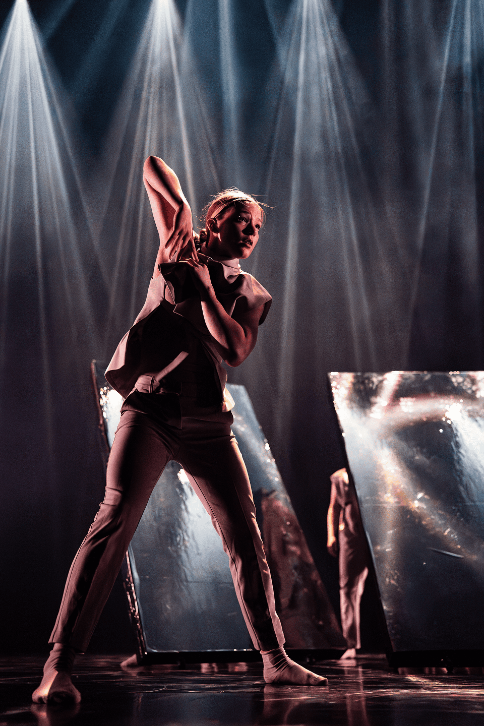 Dancers with one leg up.