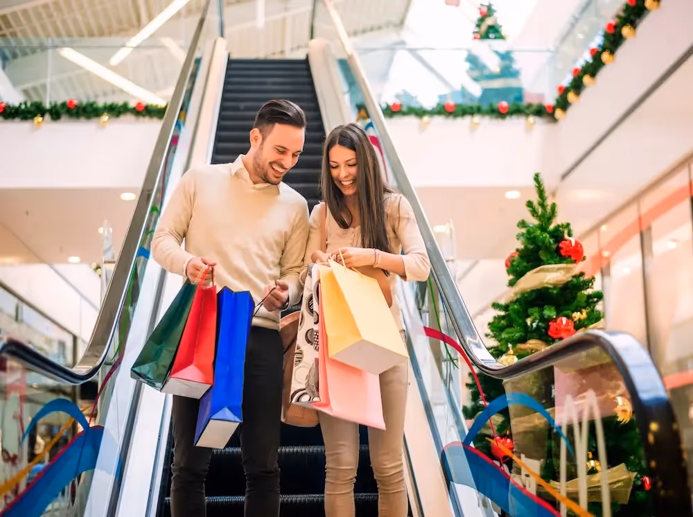 happy-couple-holiday-shopping-in-mall