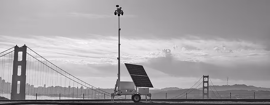 Black and white image of a LiveView Technologies solar-powered security tower with Golden Gate Bridge.