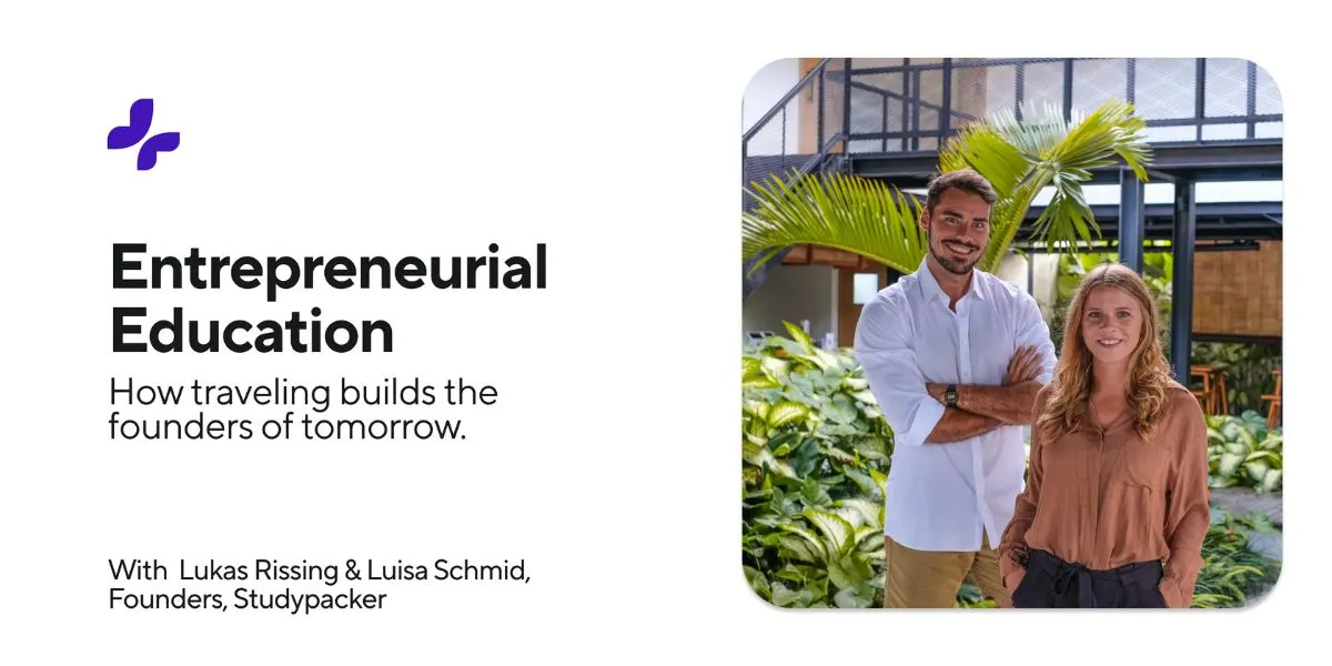 Two founders stand smiling in a lush green garden, representing entrepreneurial education and travel building future leaders.